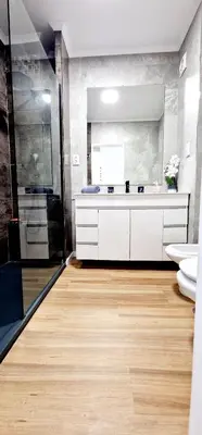 a bathroom with a toilet and a sink and a shower at Fantástico T2 Perto da Praia da Falésia, Albufeira in Albufeira