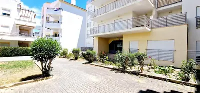 a walkway in front of a building at Fantástico T2 Perto da Praia da Falésia, Albufeira in Albufeira
