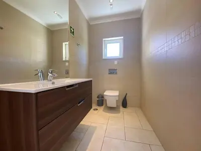 a bathroom with a sink and a toilet at Villa 
