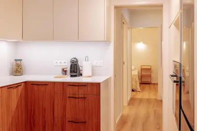a white kitchen with a sink and a dishwasher at Olhos de Água Beach Apartments by Mycelia in Olhos de Água