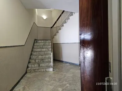 a staircase in a house with a stone floor at Blife Eduardya - private rooms at Santantonya 5th floor in Faro