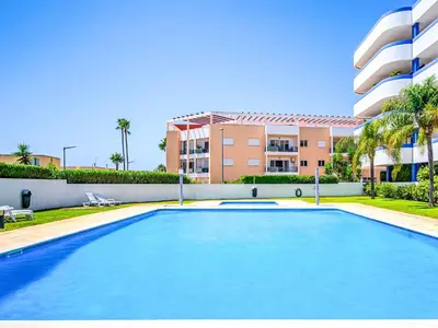 a large swimming pool in front of a building at Apartment Mediterrâneo by Interhome in Vilamoura