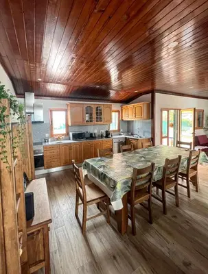 a large kitchen with a large table and chairs at Villa with pool in the Heart of Oura - Albufeira in Albufeira