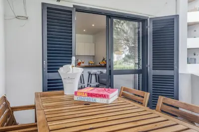 a pizza box sitting on top of a wooden table at Sunshine Apartment in Vilamoura