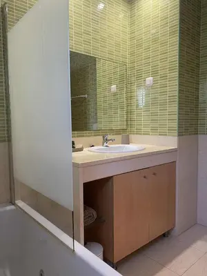 a bathroom with a sink and a mirror at Algarve Boho Beach House in Albufeira