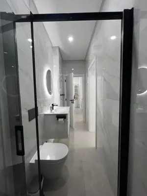 a bathroom with a toilet and a sink and a shower at Cantinho da Paz in Faro