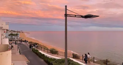 a street light on the side of a beach at Apartamento T1 Pau da Bandeira in Caliços