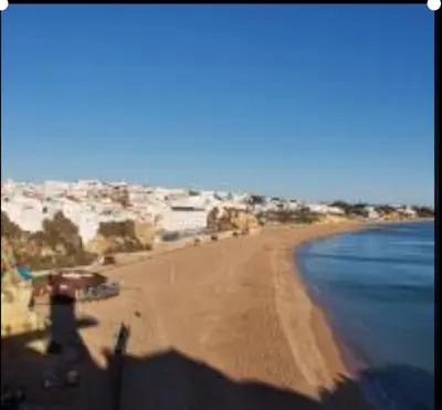 a view of a sandy beach with the ocean at Ocean view Cerro Branco with pool in Albufeira