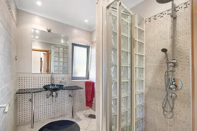 a bathroom with a sink and a shower with a sink at Sunshine Villa em Vilamoura in Vilamoura
