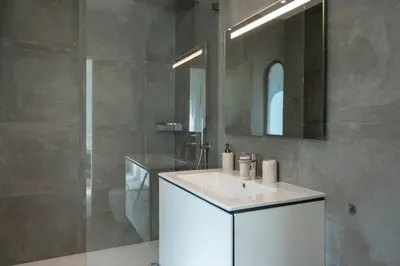 a bathroom with a white sink and a mirror at Villa Cyan by SAPvillas in Vilamoura
