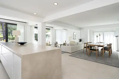 a kitchen and living room with a table and chairs at Villa Cyan by SAPvillas in Vilamoura