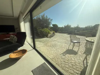 a view of a patio from a sliding glass door at Villa mar e Serra in Loulé