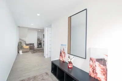 a living room with a large mirror on the wall at Casa Biabella in Albufeira