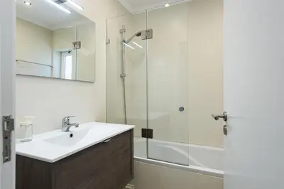 a bathroom with a sink and a shower at Moura One - Condominium with pool by HD in Vilamoura