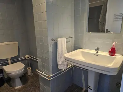 a bathroom with a sink and a toilet at Blife Spanya - private rooms at Santantonya 3rd floor in Faro