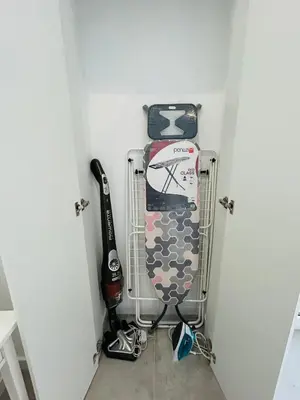 a room with a rack with golf equipment in it at Casa Eliz Modern Comfort in the center of Faro in Faro