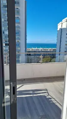a view of the ocean from the balcony of a building at Beautiful View Apartment in Quarteira