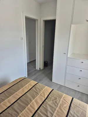 a bedroom with a bed and a large mirror at Beautiful View Apartment in Quarteira