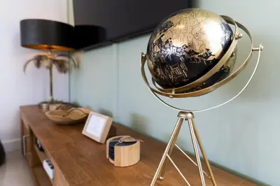 a globe on a stand on a table at #339 Albufeira Terras Novas N 4 By Home Holidays in Patroves