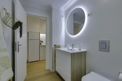 a bathroom with a sink and a mirror at GINGKO BILOBA ROOF TOP by My Algarve Rentals in Quarteira