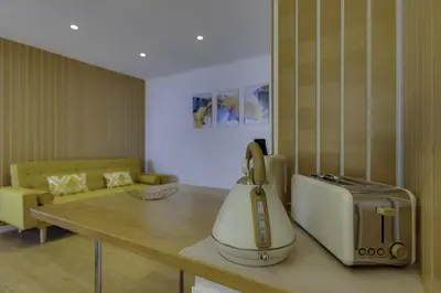 a kitchen with a toaster sitting on a counter at GINGKO BILOBA ROOF TOP by My Algarve Rentals in Quarteira