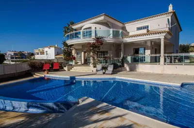 a large house with a swimming pool in front of it at Luxury Villa with Private Pool, Gym & Leisure Room by Gale Beach LM25 in Guia