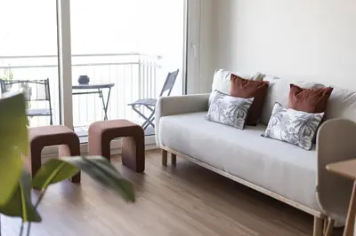 a living room with a couch and a table at Mira Mar 2 - Near the beach by HD in Quarteira
