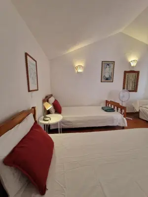 a bedroom with two beds and a window at Vintage design villa in Vale do Lobo in Loulé