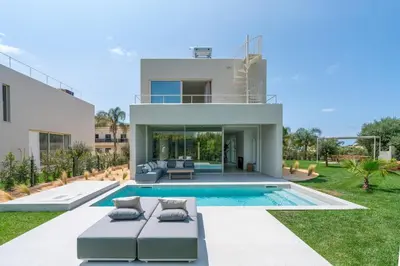 a villa with a swimming pool and a house at New Villa - Rooftop Jacuzzi & Sunset Views in Santa Bárbara de Nexe