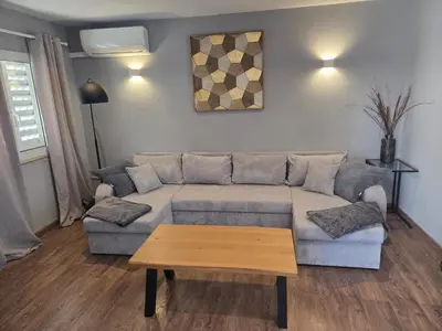 a living room with a couch and a coffee table at Casa Madalena in Albufeira