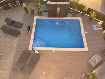 an overhead view of a swimming pool with chairs at Casa Madalena in Albufeira
