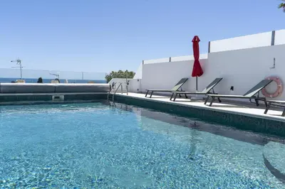 a bedroom with a bed with the words home holidays at #285 Vista do Mar By Home Holidays in Albufeira
