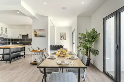 a kitchen with a table with a bowl of bread on it at #285 Vista do Mar By Home Holidays in Albufeira