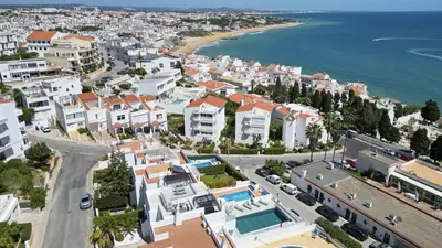 a living room with a couch and chairs at #285 Vista do Mar By Home Holidays in Albufeira