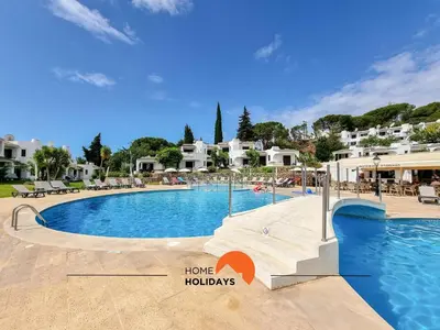 a large swimming pool in a resort at #121 T1 Aconchegante em Albufeira by Home Holidays in Albufeira