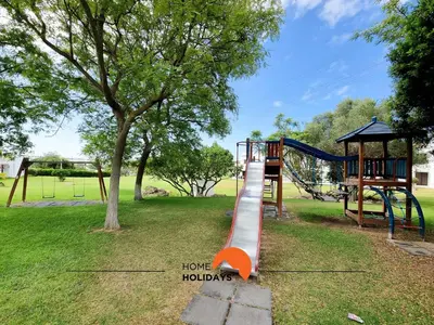 a playground with a slide in a park at #121 T1 Aconchegante em Albufeira by Home Holidays in Albufeira
