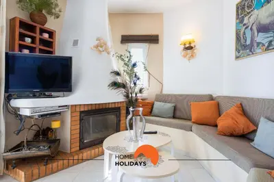 a living room with a couch and a tv at #121 T1 Aconchegante em Albufeira by Home Holidays in Albufeira