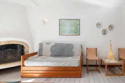 a bedroom with a bed and a fireplace at Casa dos Bisos in Albufeira