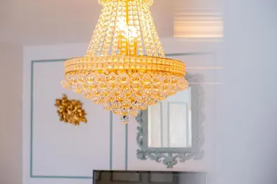 a large yellow chandelier hanging from a ceiling at Apartment Solera in Albufeira