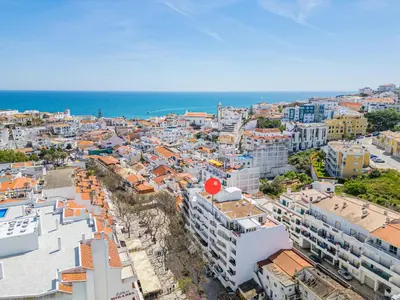 an aerial view of a city with buildings and the ocean at Apartment Solera in Albufeira