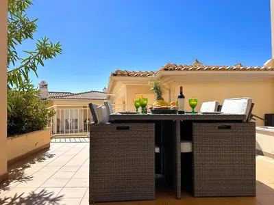 a dining room with a table and chairs with fruit on it at Casa Antonius, Sun & Pool Balaia Home by BeCherish in Atalaia
