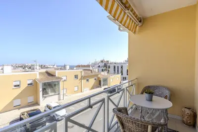 a balcony with a table and a view of a city at #340 Old Town Garden Hill Z by Home Holidays in Albufeira