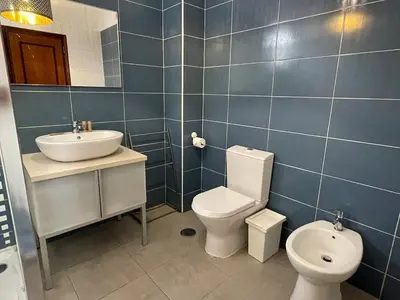 a bathroom with a toilet and a sink at Maryland Terrace by RPG Properties in Albufeira