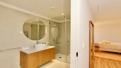 a bathroom with a sink and a shower at Casa Centavo - Natura Village, CD 317 - Cleverdetails in Quarteira