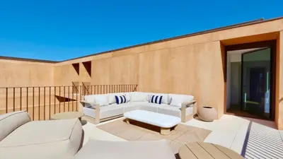 a patio with two white couches on a balcony at Casa Centavo - Natura Village, CD 317 - Cleverdetails in Quarteira