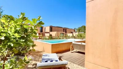 a backyard with a swimming pool and a house at Casa Centavo - Natura Village, CD 317 - Cleverdetails in Quarteira