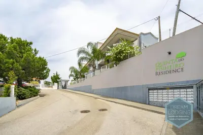 an empty street in front of a building at Pinheiro Residence - Dream Lodging in Albufeira