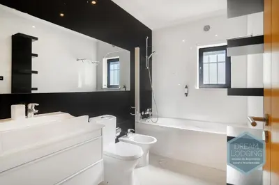 a bathroom with a toilet and a sink and a bath tub at Pinheiro Residence - Dream Lodging in Albufeira