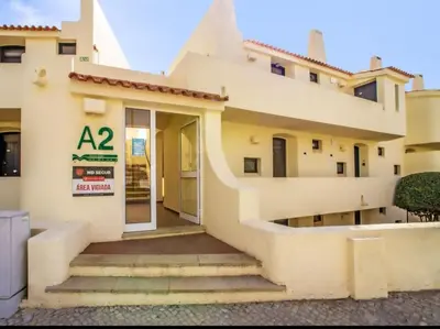 a house with stairs leading to the door at Sea view studio, terrace & pools - Albufeira in Albufeira