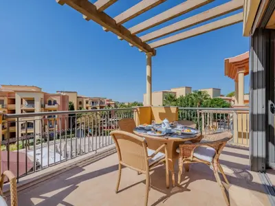 a patio with a table and chairs on a balcony at Apartment The Residence at Victoria by Interhome in Vilamoura